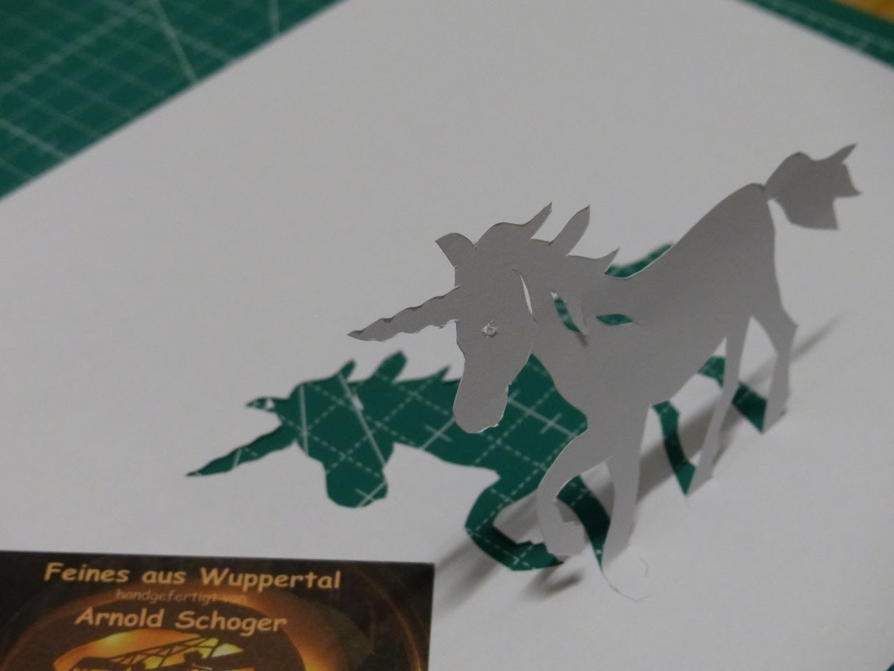 The white unicorn, a simple paper cut by Arnold Schoger