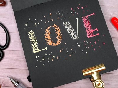 Kleines Lettering auf schwarzem Papier mit Gelly Rolls