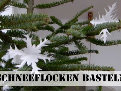 Papier-Schneeflocken falten